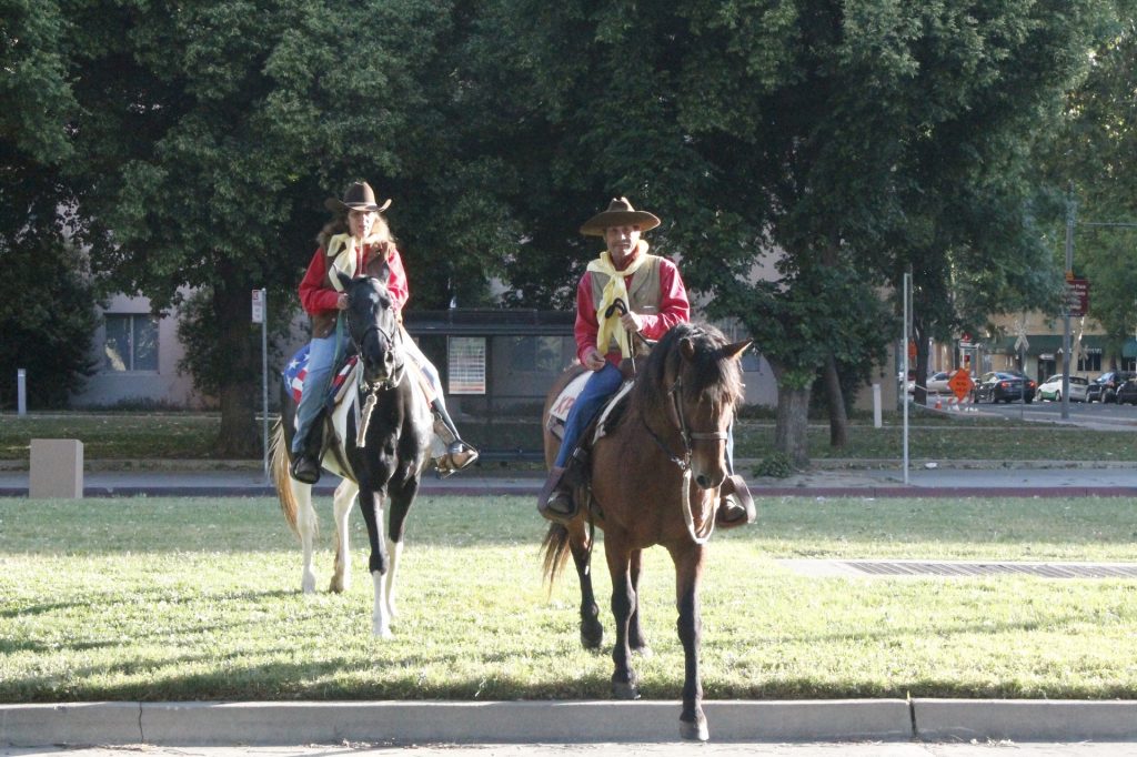 Two horses and their riders trotting on the Pony Express Trail