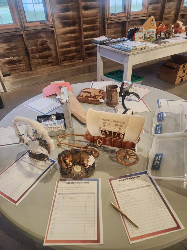 Silent auction table from Convention 2026
